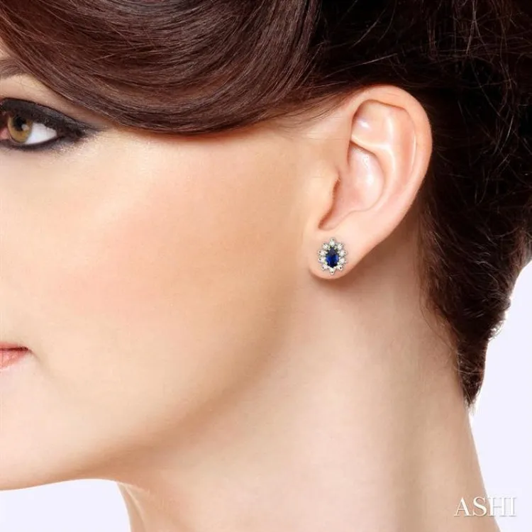 5x3MM Oval Cut Sapphire and 1/4 ctw Round Cut Diamond Earrings in 14K Yellow Gold