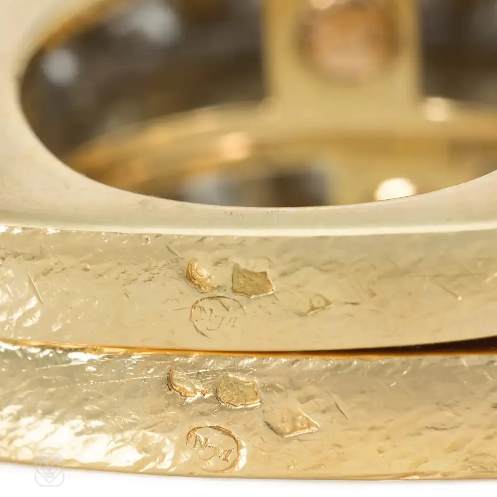 A pair of French gold, platinum, and diamond twist rings for Neiman Marcus