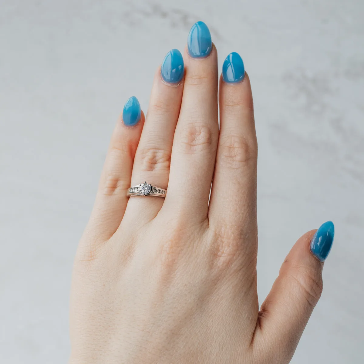 Channel Set Accented Solitaire Diamond Engagement Ring