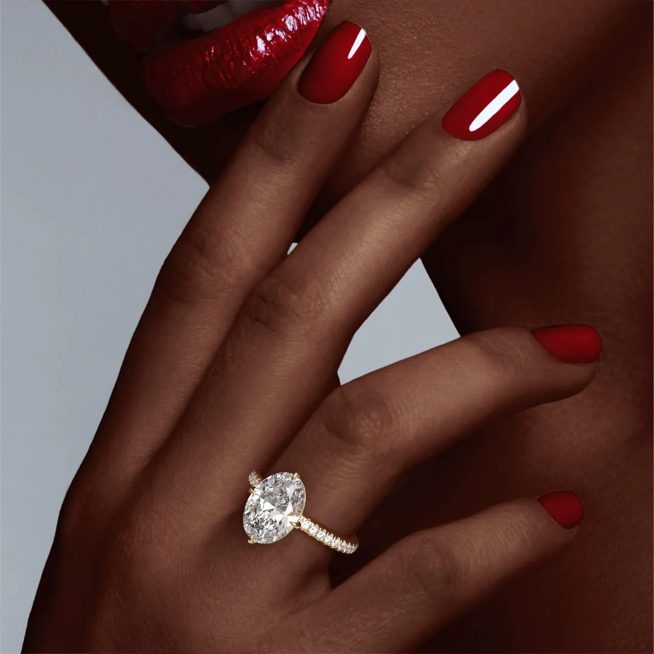OVAL CUT DIAMOND ENGAGEMENT RING WITH A COMPASS 4 PRONG THREE PHASES PAVE SETTING IN 18K YELLOW GOLD