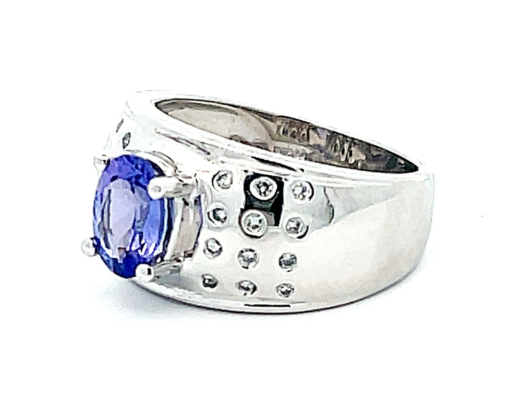Oval Tanzanite and Diamond Studded Wide Dome Ring in Platinum