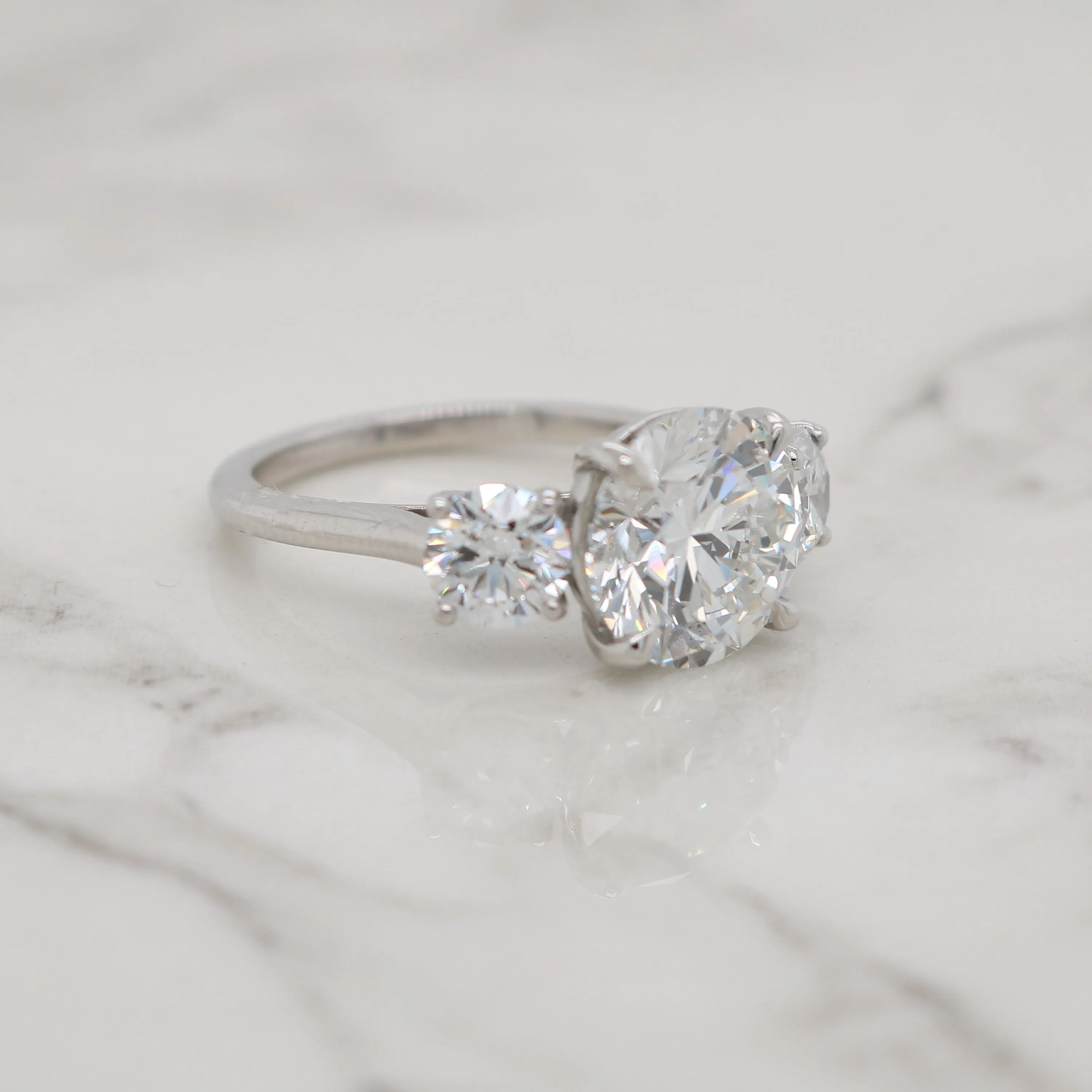 Round Cut Three Stone Engagement Ring
